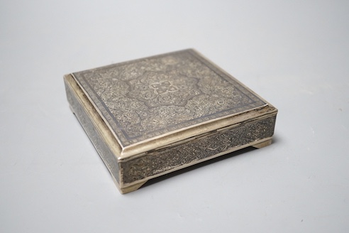 A Persian engraved white metal and niello cigarette box, stamped 84, 11.9cm, gross 12.5oz.